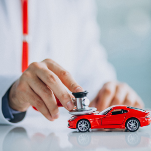 Car doctor with stethoscope in a car showroom